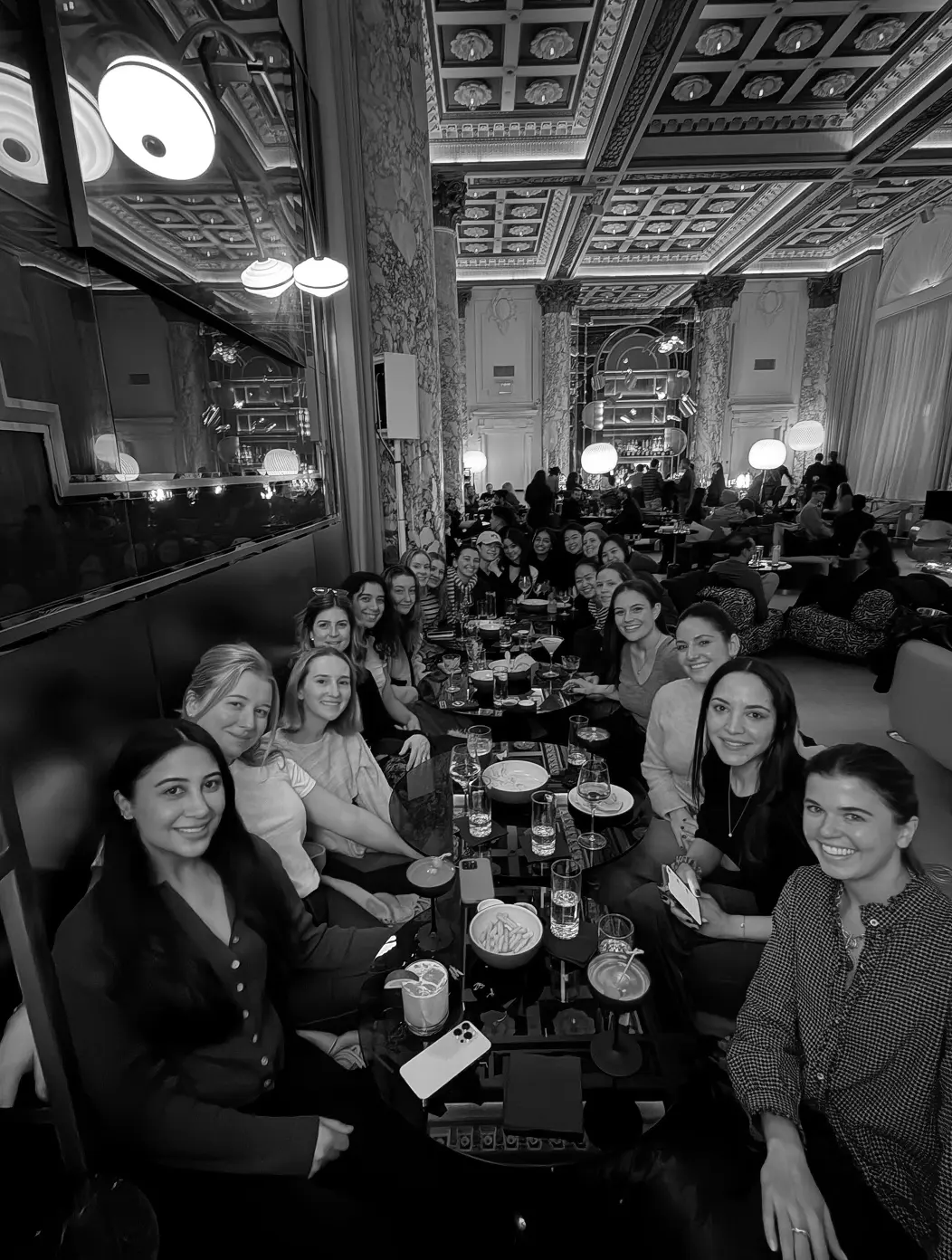 Profound teammates sharing a restaurant dinner